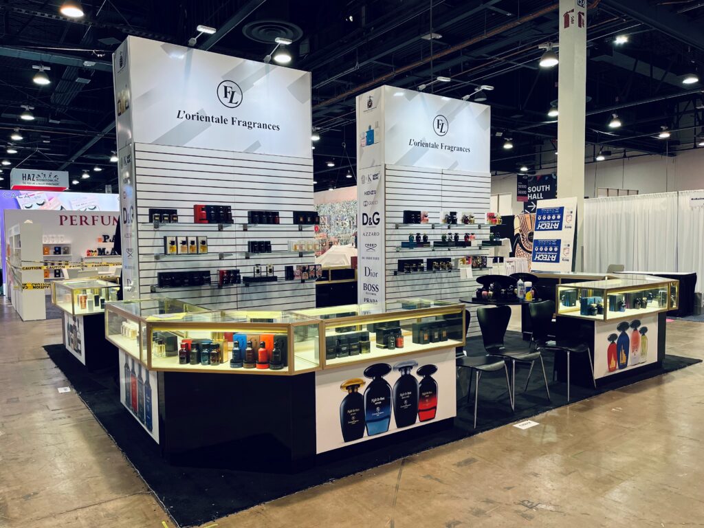 Perfume Plus custom trade show booth with backlit product shelving