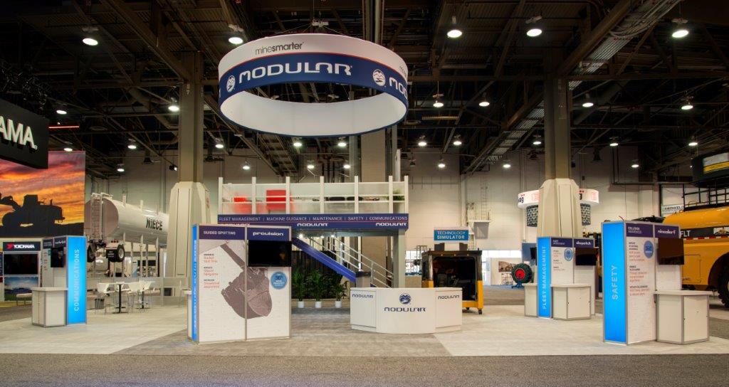 Double-deck trade show exhibit viewed from the show floor
