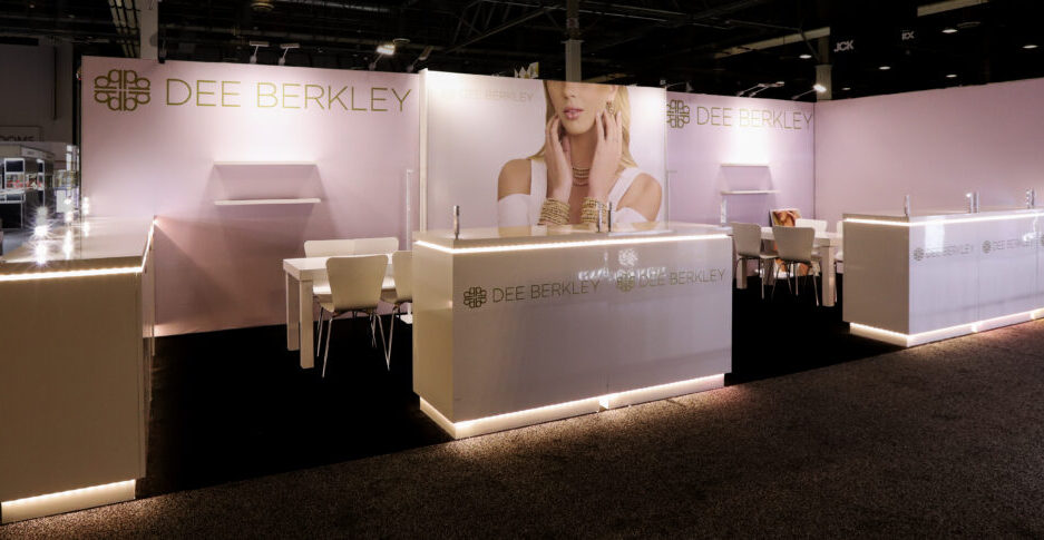 Linear inline trade show booth display with branded back wall