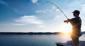 man fishing from boat during icast 2018